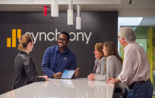 five employees conversating