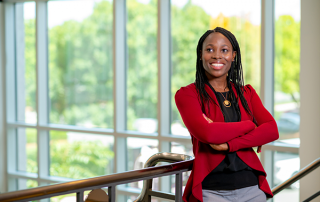 CS-1 Synchrony employee smiling at camera