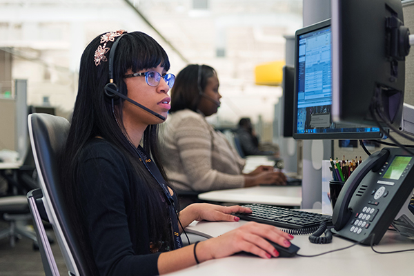 woman working with a headset at desk