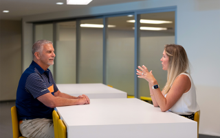 FIN-3 man and woman sitting at table