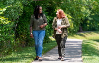 two women walking outside