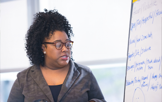woman using white board