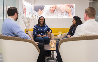 Group of four sitting with each other
